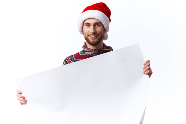 emotional man white paper billboard advertising light background - Фото, изображение