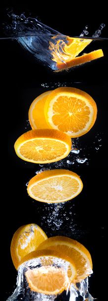 slice of orange in the water with bubbles - Фото, зображення