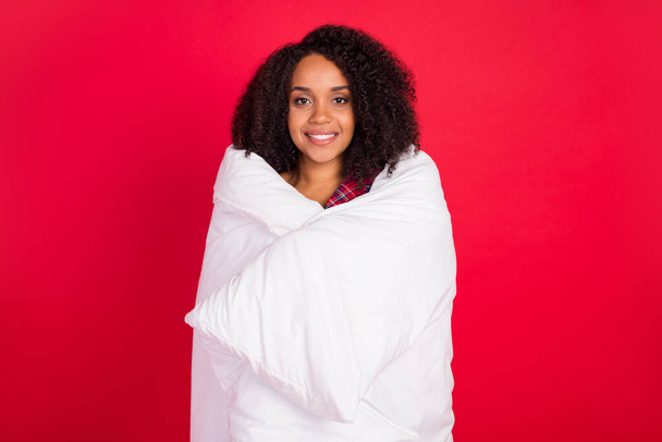 Photo of trendy young afro american woman wear blanket christmas mood isolated on red color background - Photo, Image