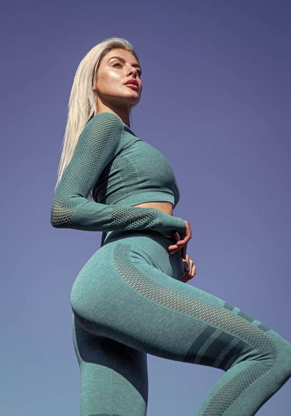 sexy woman with tight butt wear sportswear outdoor, fitness - Foto, Imagen