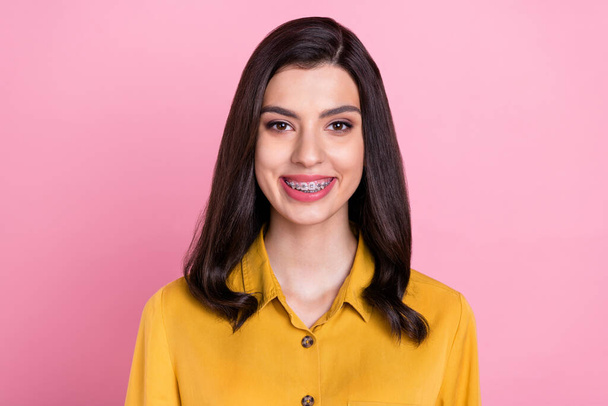 Photo of nice optimistic brunette hair young lady wear yellow shirt isolated on pink color background - Fotografie, Obrázek