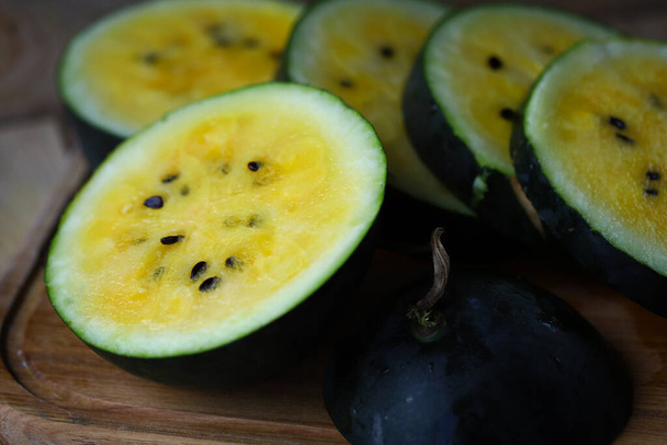 Yellow watermelon slices with seeds. - Photo, image