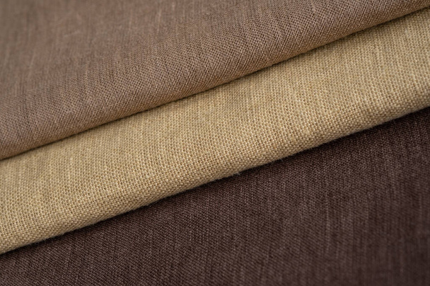 Bruin linnen patroon textuur achtergrond. Strepen stof. Macro met ondiepe dof - Foto, afbeelding