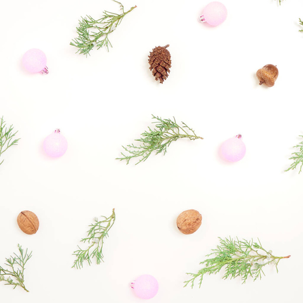 Christmas pattern. New Year decorations on blue background. Thuja, cones and hristmas decorations.  - Фото, зображення