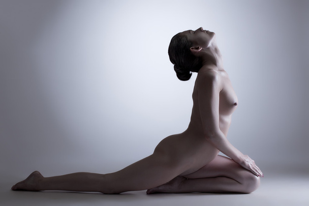 Concept of inner balance. Nude woman in studio - 写真・画像