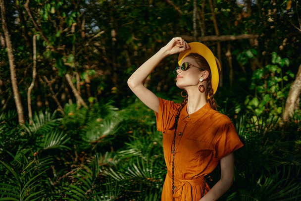 women in sundress hat on head glasses jungle travel model - Photo, Image