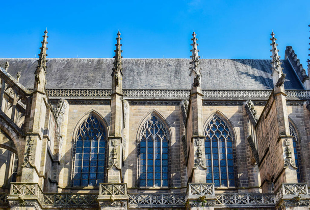 The beautiful gothic style windows and the roof of The Limoges Cathedral against the sky - Photo, image