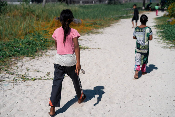 Kids walking in Sibuan Island, Semporna, Borneo, Sabah, Malaysia. - Photo, Image