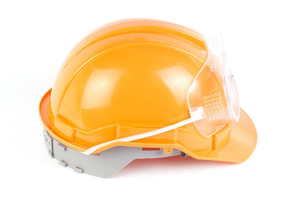 オレンジ色の安全ヘルメットとゴーグル - 写真・画像