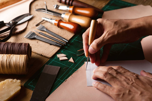 Working with vegetable tanned leather. Leather and the craft tools. - Photo, Image
