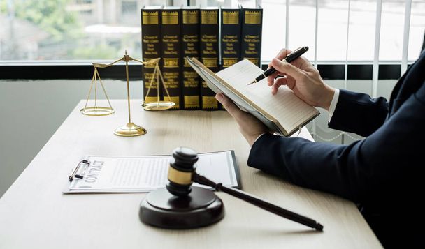Professional man lawyers work at a law office There are scales, Scales of justice, judges gavel, and litigation documents. Concepts of law and justice. - Photo, Image
