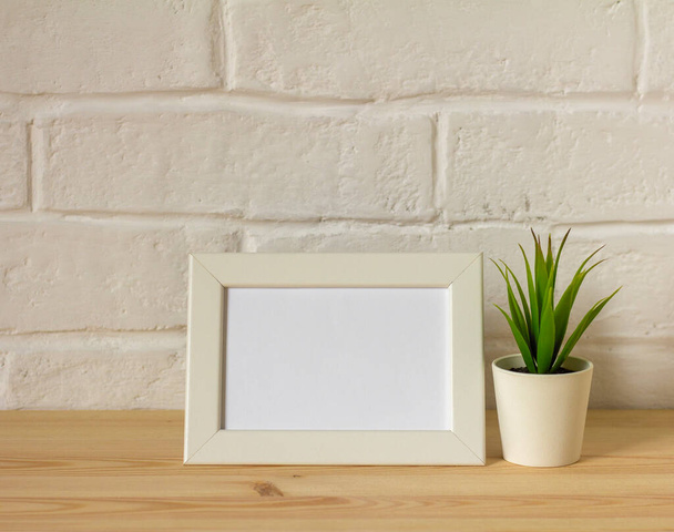 An empty photo frame on a table or shelf with a copy of the space - Fotoğraf, Görsel