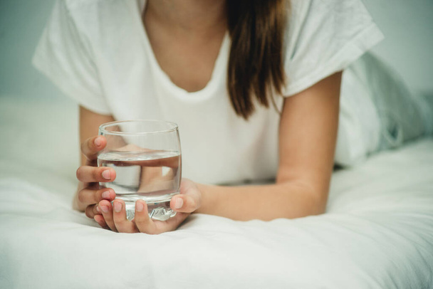 a glass of water in hands close-up - Foto, immagini