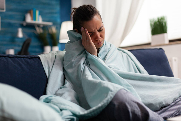 Caucasian woman feeling sick at home with headache - Photo, Image