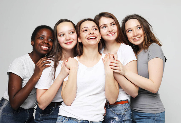Lifestyle, friendship, emotion and people concept: five multiracial, african american, european and asian girls - Φωτογραφία, εικόνα
