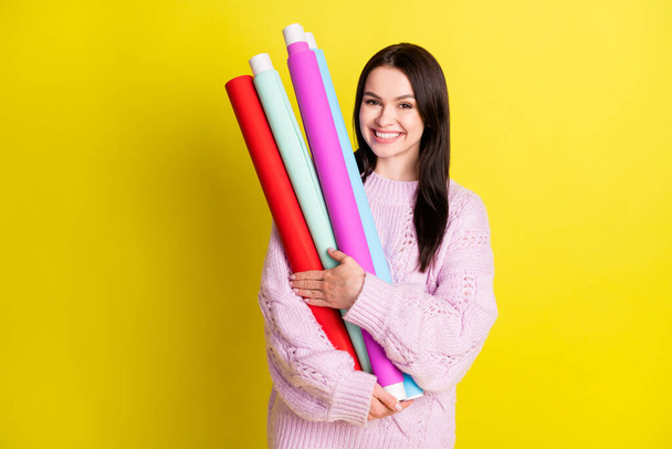 Photo of lovely millennial lady cuddle rolls want pack present wear sweater isolated on yellow background - Foto, afbeelding