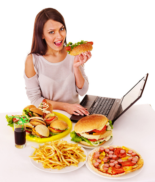 Woman eating junk food. - Photo, Image