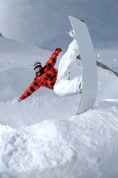 Jumping freestyle snowboarder - Photo, Image