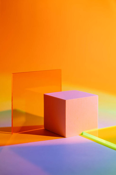 Cube podium with acrylic plate  on colorful gradient background. Stylish geometric shapes to show  products.   - Photo, image