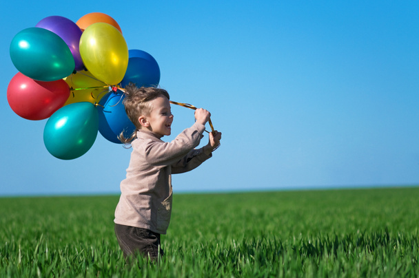 Child with balloons - 写真・画像