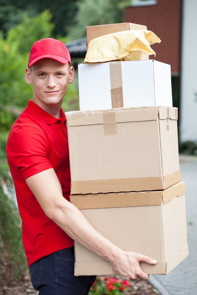 Delivery man holding cardboard boxes - Foto, Imagem