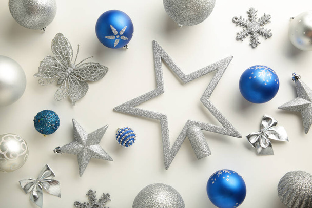 Blue and silver Christmas decoration on white background, top view, flat lay. New Year composition - Photo, image
