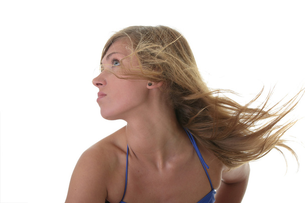 A beautiful young blond woman wearing a blue bikini - Foto, imagen