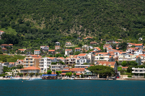 View of the coast of the Bay of Kotor with houses, Montenegro - Photo, Image
