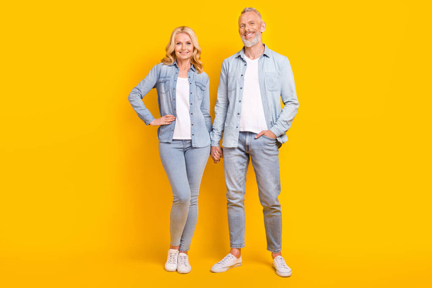 Full length photo of old happy couple cheerful spouses good mood smile isolated on yellow color background - Foto, Imagem