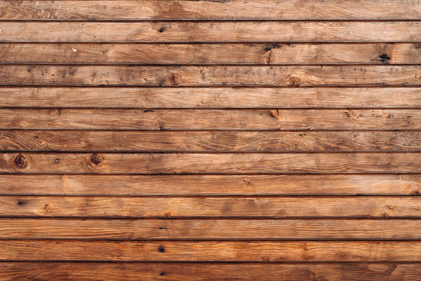 Reclaimed wood wall paneling texture. Wall of wooden fence. Winter wooden plank background, brown horizontal boards, wood texture. Stock photo - Photo, Image