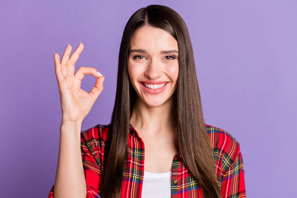 Photo of cool long hairdo young lady show okey sign wear red shirt isolated on violet color background - Foto, immagini