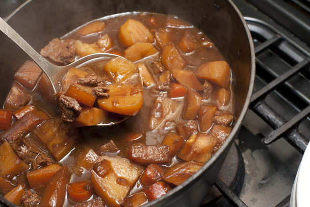 Delicious beef stew cooking in a pot - Photo, Image