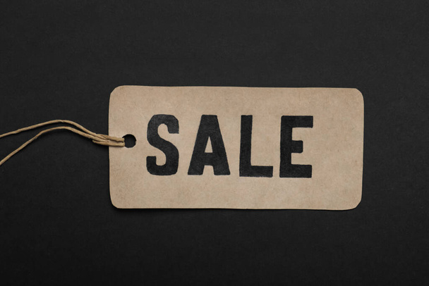 Sale tag on color background, top view. Black Friday - Photo, image