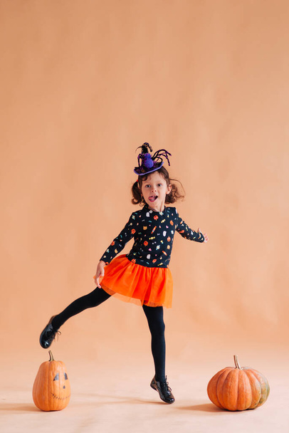 Happy girl dressed as a witch for Halloween - Foto, imagen