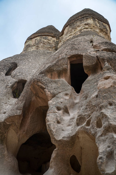 Beautiful Cappadocia landscape. Unique geological formations with stone rock houses and caves Tourism and travel. - Fotó, kép