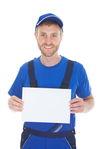 Male servant holding blank placard - Foto, immagini