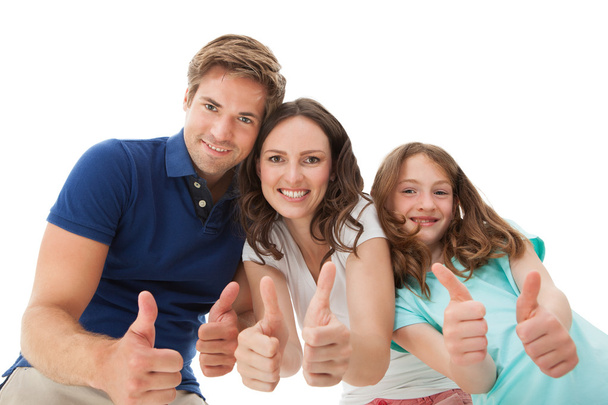 Happy Family Gesturing Thumbs Up - 写真・画像