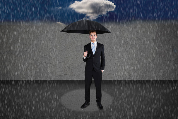 Businessman with Umbrella Under Rain - Foto, imagen