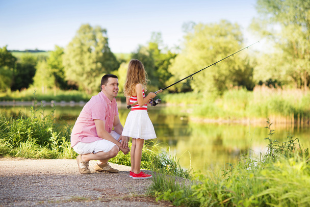 Father fishing with daughter - Foto, immagini