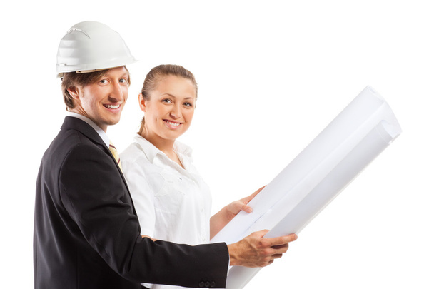 An architect wearing a hard hat and co-worker - Photo, Image
