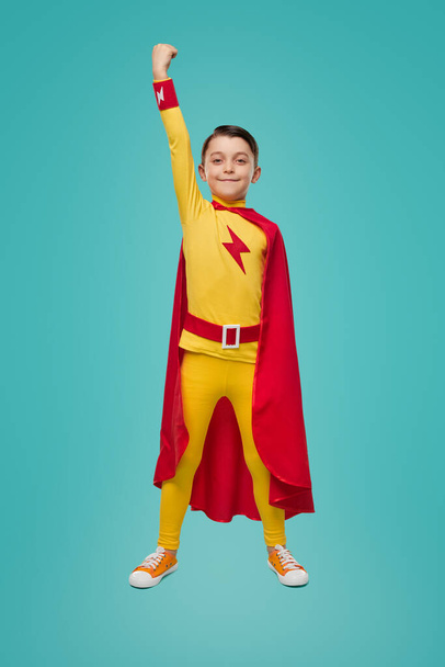 Brave superhero child with arm raised - Fotoğraf, Görsel