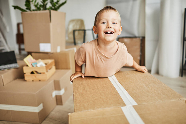 Cute Boy Moving Boxes in New Home - Φωτογραφία, εικόνα