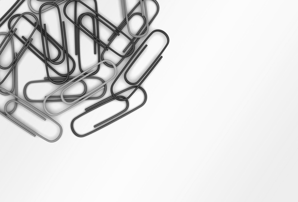 Grey paper clips scattered in a chaotic manner - Foto, afbeelding