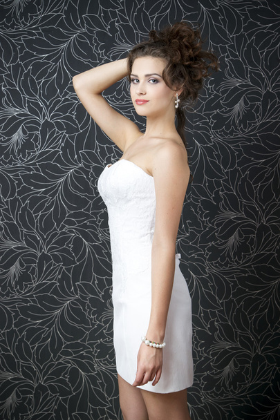 Beautiful woman in white wedding dress - Фото, изображение