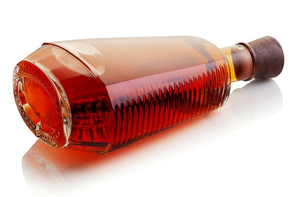 A bottle with a strong alcoholic drink on a white background - Foto, Bild