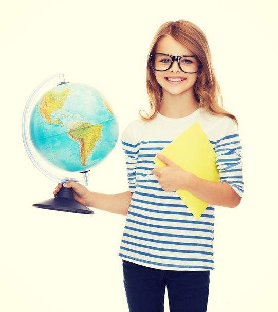 smiling child with globe, notebook and eyeglasses - Photo, Image