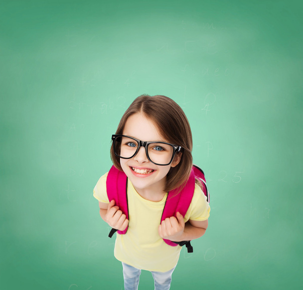 happy smiling teenage girl in eyeglasses with bag - Fotografie, Obrázek