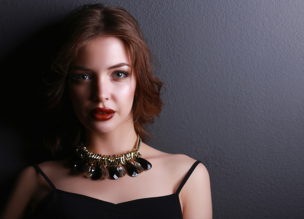 Portrait of young beautiful woman with jewelry - Photo, Image