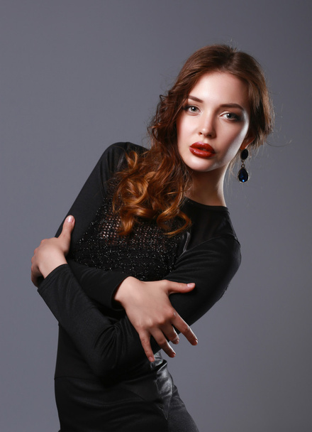 Portrait of beautiful brunette woman in black dress - Photo, image