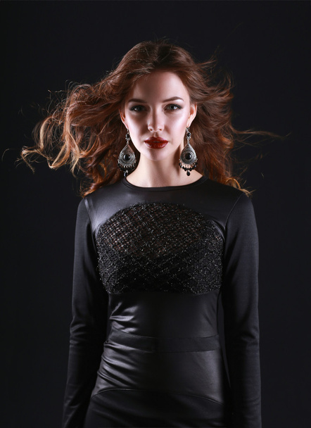 Portrait of beautiful brunette woman in black dress. - Foto, Imagen